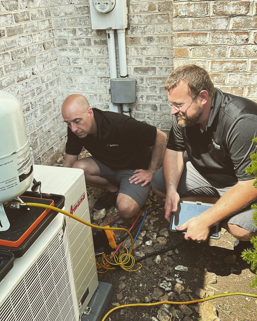 repairman fixing an AC outside