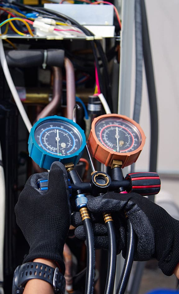 An HVAC technician inspecting commercial equipment.