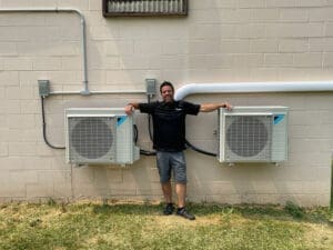 Prime Home HVAC technician with multi-zone outdoor HVAC equipment.